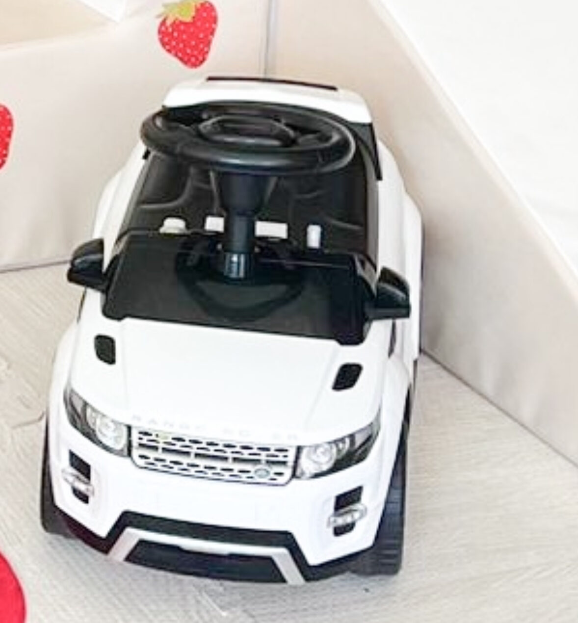 a child's modern white SUV style ride-on