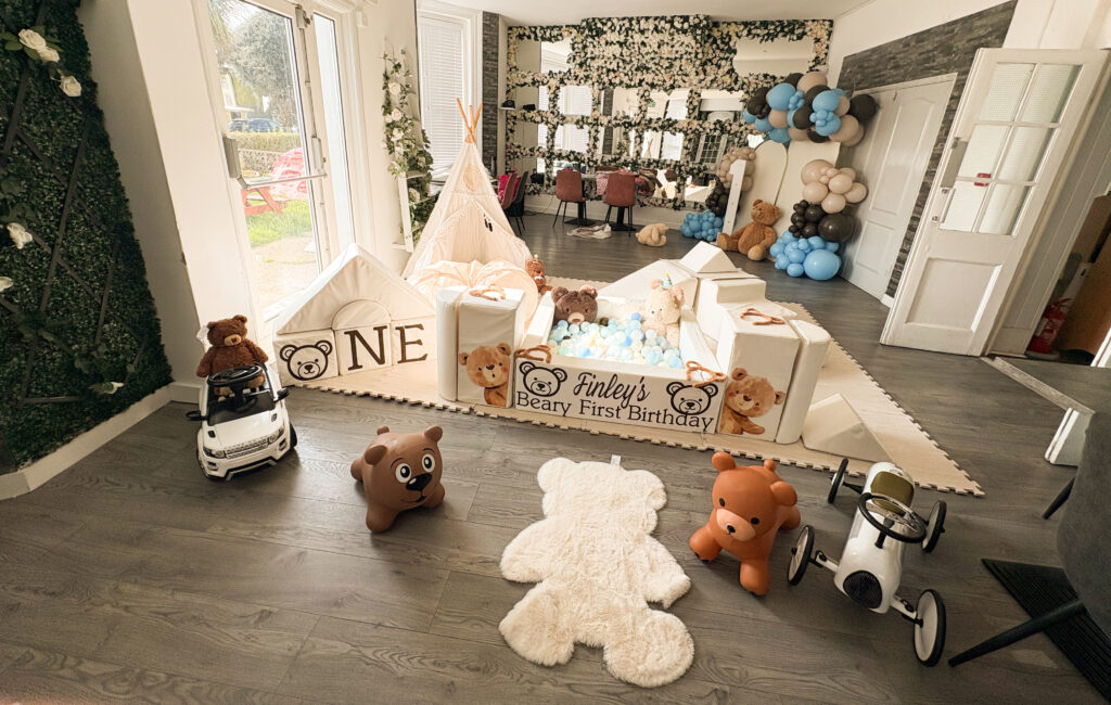 "Beary first birthday" themed party package setup in white and browns