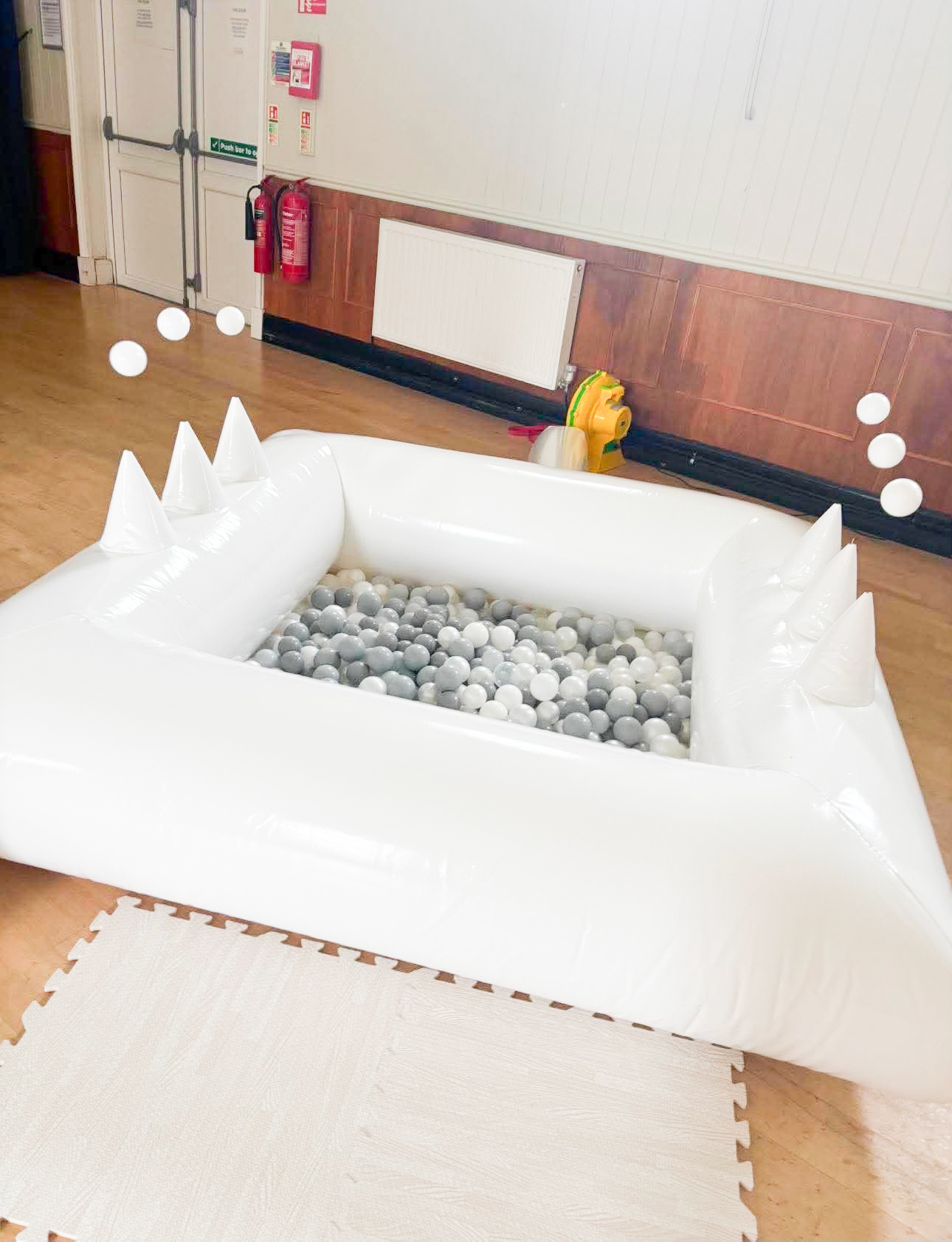 Air Juggler Ball Pit with white and grey balls inside